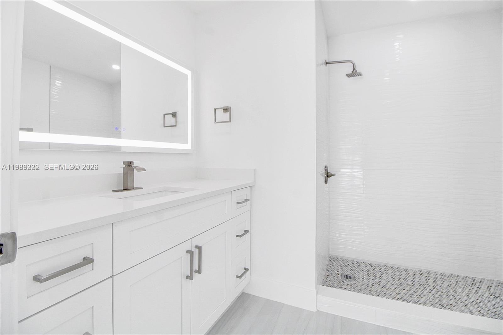 8961 Southwest 6th Street Miami, FL 33174 - Photo 10 of 26 a bathroom with a sink and a mirror