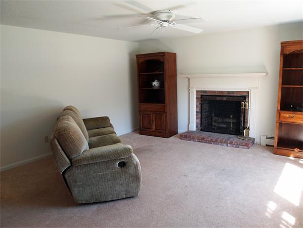 50 Oldham Road Barnstable, MA 02655 - Photo 6 of 11 a living room with furniture and a fireplace