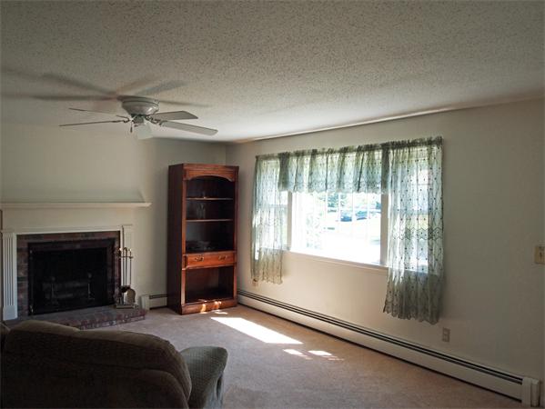 50 Oldham Road Barnstable, MA 02655 - Photo 7 of 11 a living room with furniture and a fireplace