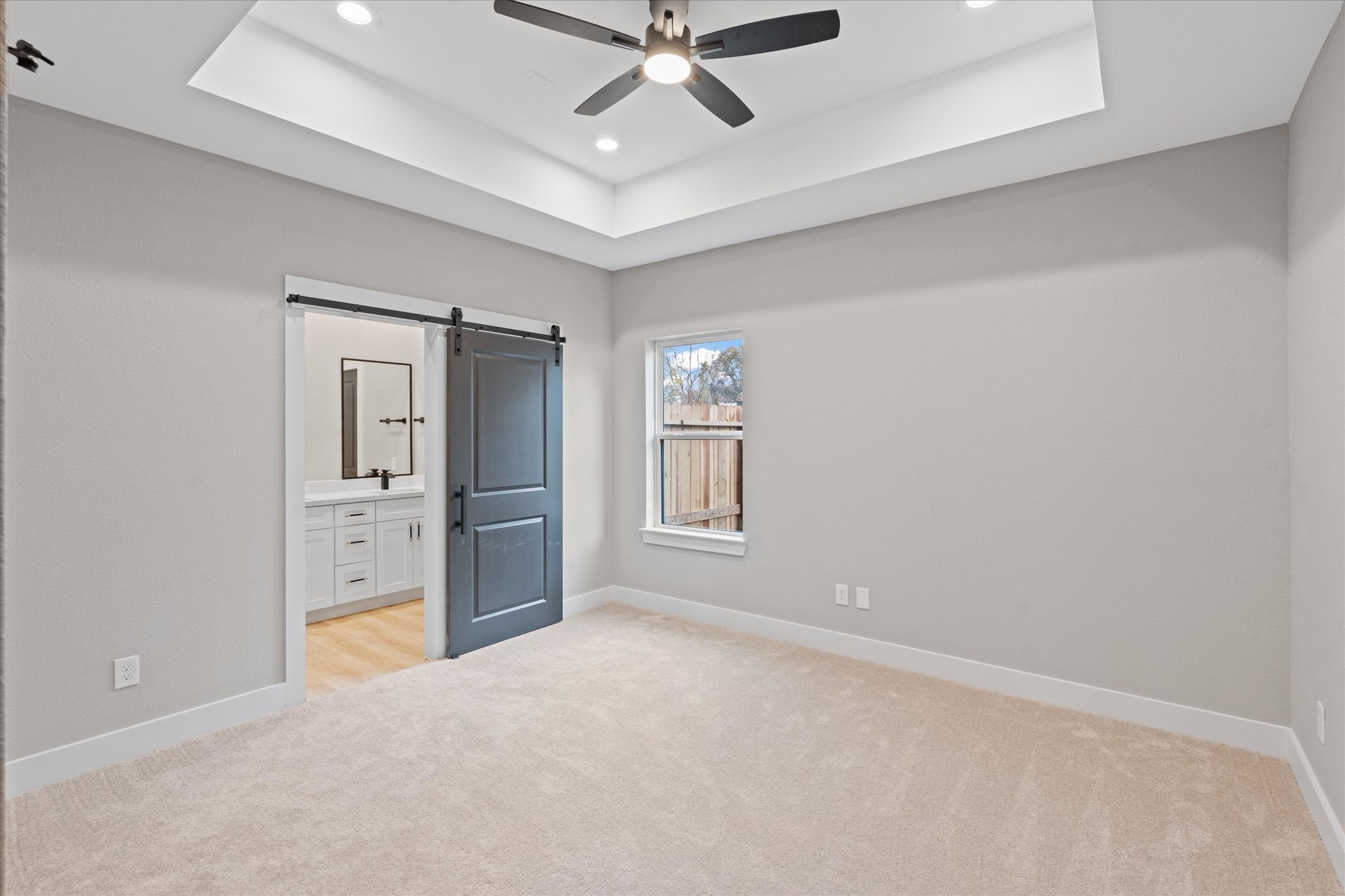 7349 Sandle Street, Unit A Houston, TX 77088 - Photo 12 of 18 an empty room with windows and cabinet