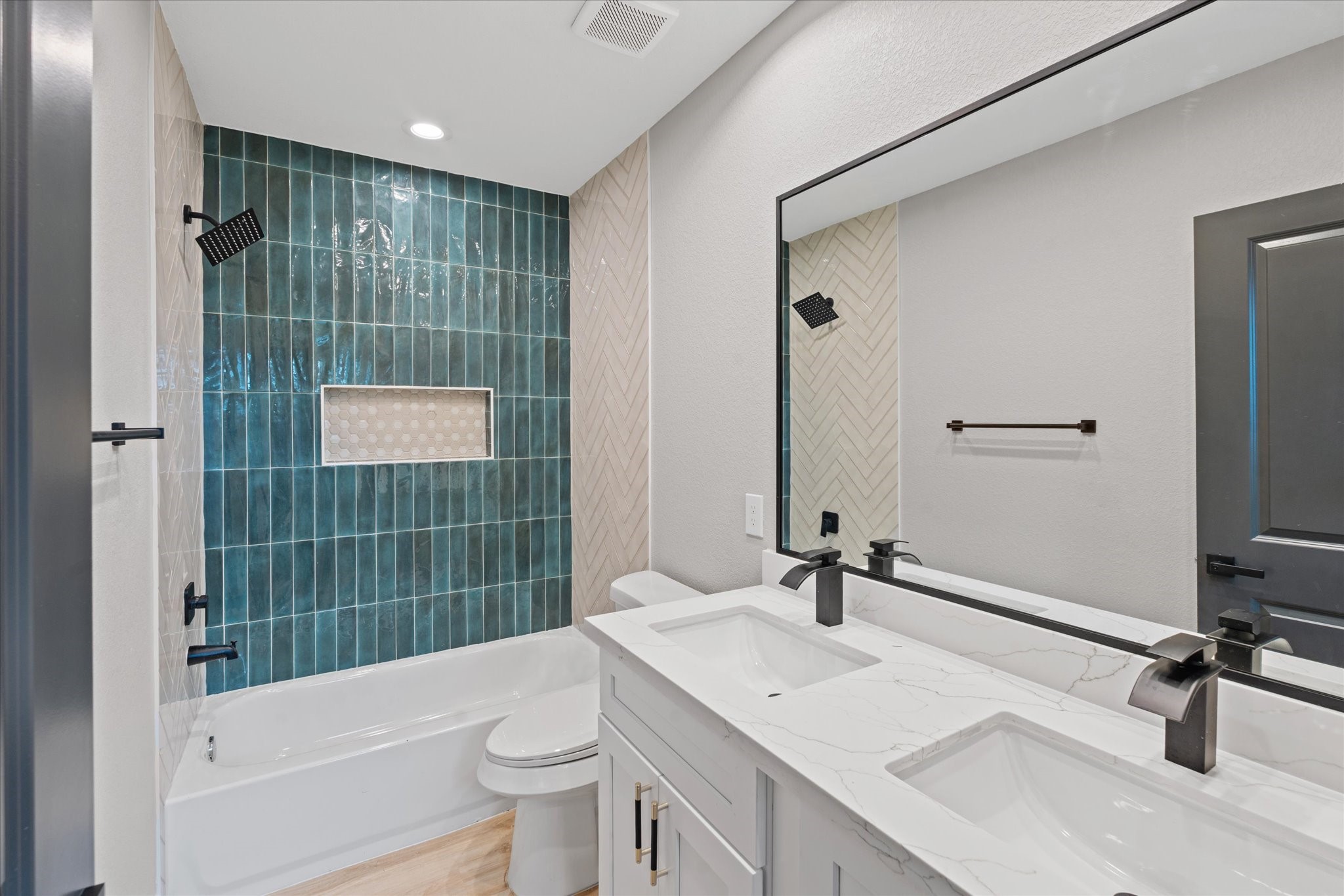 7349 Sandle Street, Unit A Houston, TX 77088 - Photo 15 of 18 a bathroom with a sink a toilet and shower