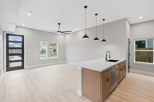 a view of a kitchen with a sink and a window