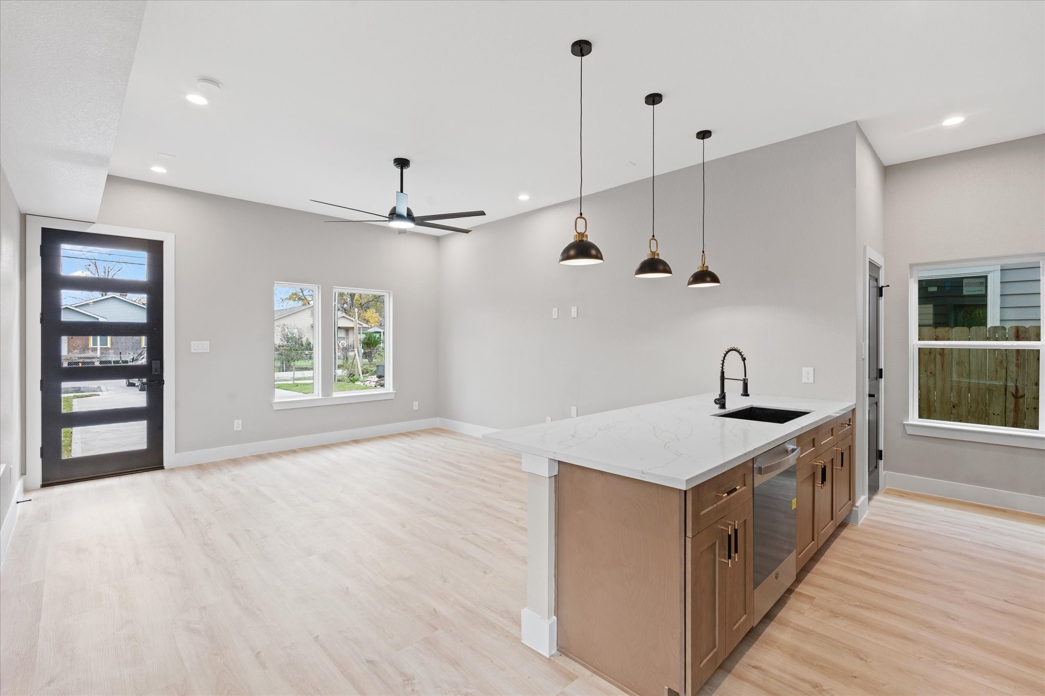 7349 Sandle Street, Unit A Houston, TX 77088 - Photo 16 of 18 a kitchen with stainless steel appliances granite countertop a sink and a stove