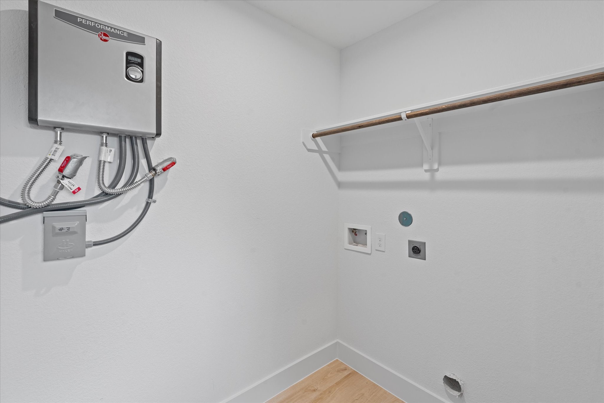 7349 Sandle Street, Unit A Houston, TX 77088 - Photo 18 of 18 a view of a hallway with rack on the wall