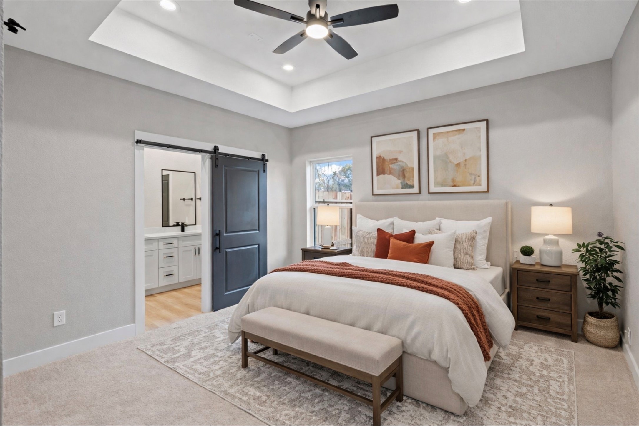 7349 Sandle Street, Unit A Houston, TX 77088 - Photo 4 of 18 a bedroom with a bed and a chandelier