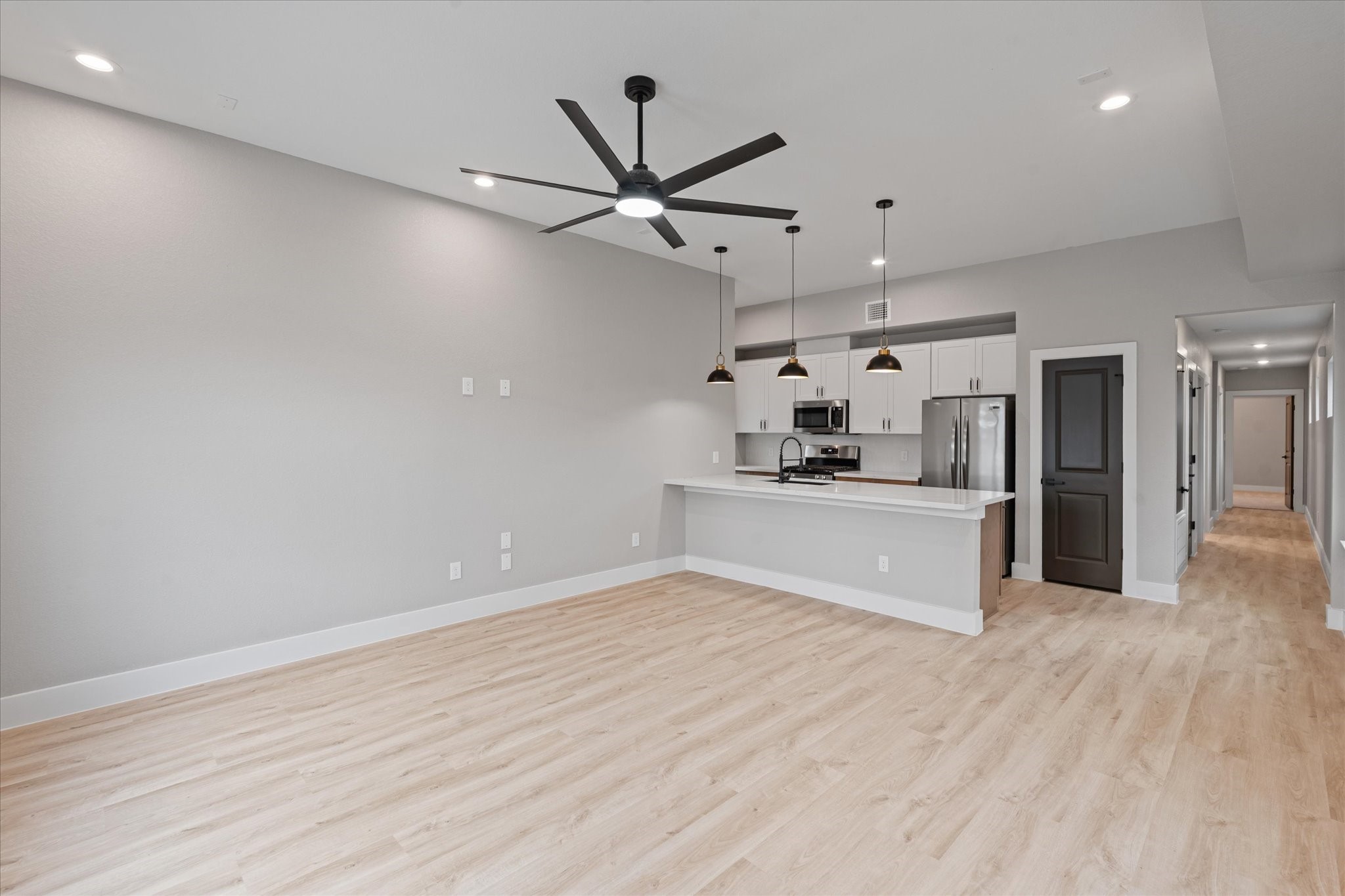 7349 Sandle Street, Unit A Houston, TX 77088 - Photo 7 of 18 a view of a kitchen with a sink and refrigerator