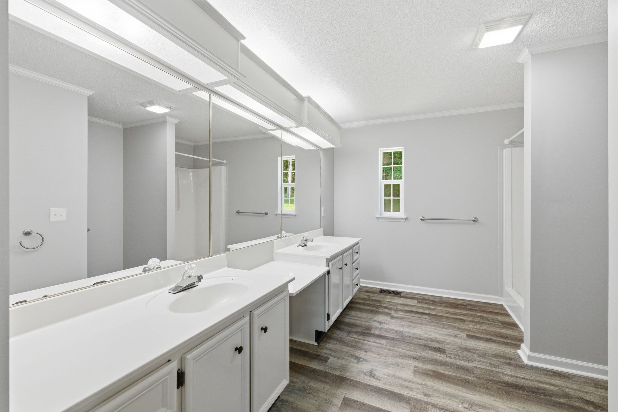 1021 B Jordan Road Lascassas, TN 37085 - Photo 30 of 58 a bathroom with a double vanity sink and mirror