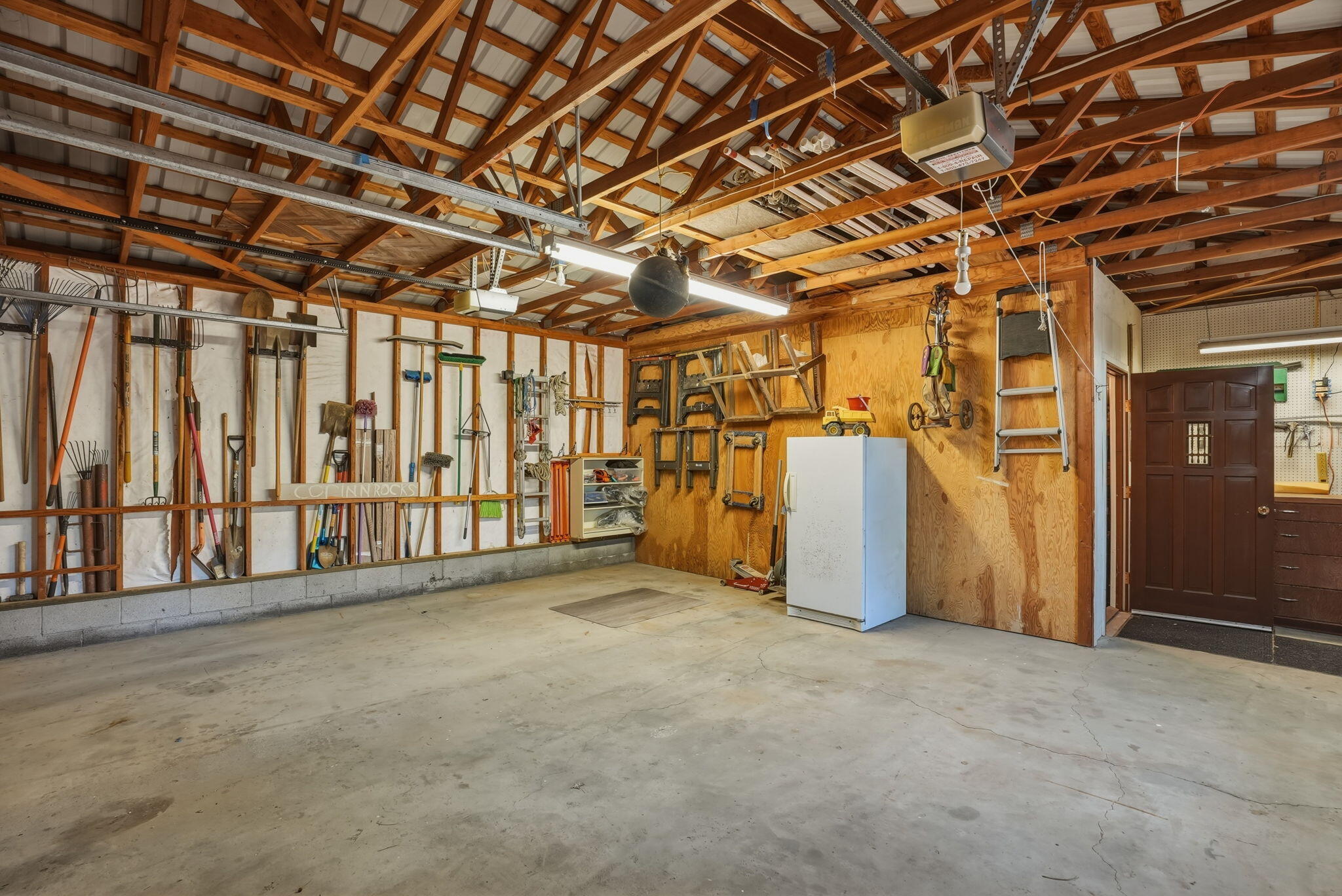 15020 Remuda Road Sisters, OR 97759 - Photo 49 of 61 Oversized garage interior and insulated/heated storage area