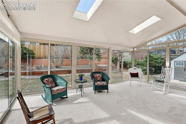 699 Gilcrest Road Colorado Springs, CO 80906 - Photo 14 of 37 Full length glass panels will make you feel like you are outside! The skylights add to the natural light.