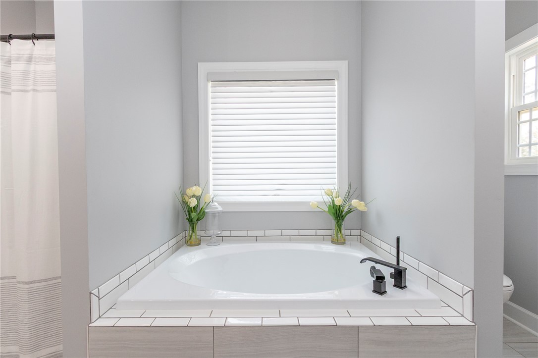 3080 McGee Road Iva, SC 29655 - Photo 32 of 49 An inviting soaking tub awaits, complete with modern fixtures and sun-filtered window views.