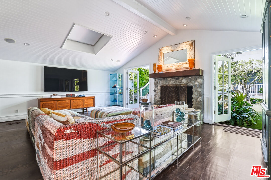 30810 Broad Beach Road Malibu, CA 90265 - Photo 20 of 55 a living room with furniture a fireplace and a flat screen tv
