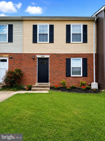 a house that has a big yard in front of it