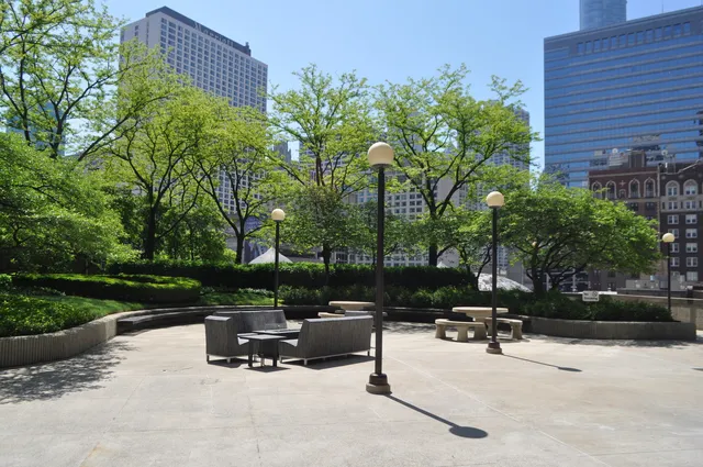 a view of a backyard with a sitting area