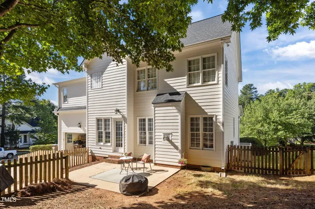a living room with a fireplace and a flat screen tv