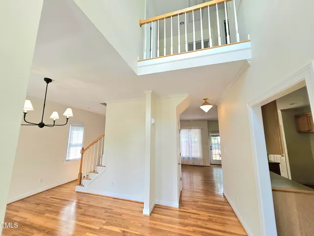 a large kitchen with stainless steel appliances a stove a sink a microwave and cabinets