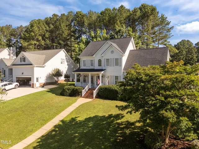 a view of a patio with a table and chairs