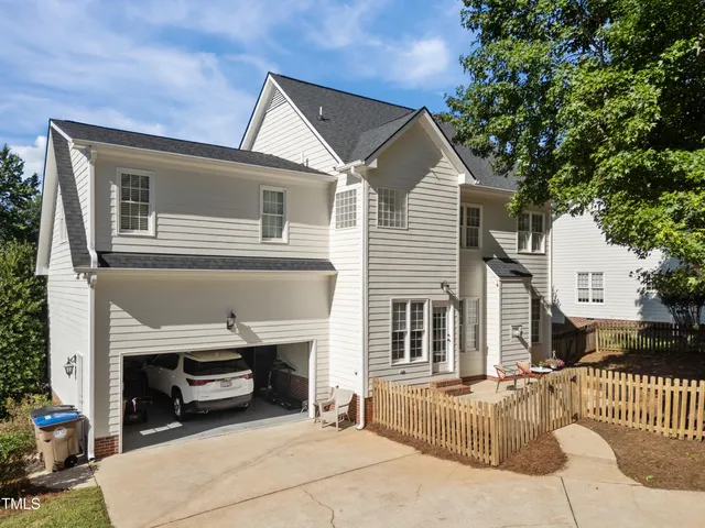 a view of a dining room with furniture and a potted plant