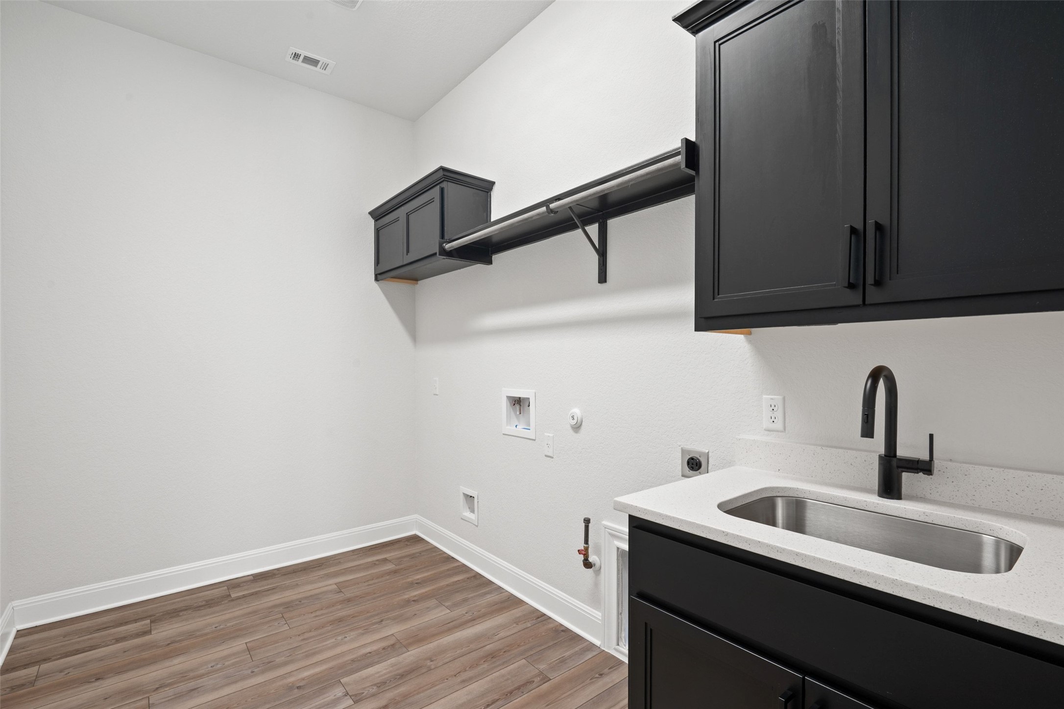 5420 Destination Way Jonestown, TX 78645 - Photo 20 of 40 Laundry room with sink and storage