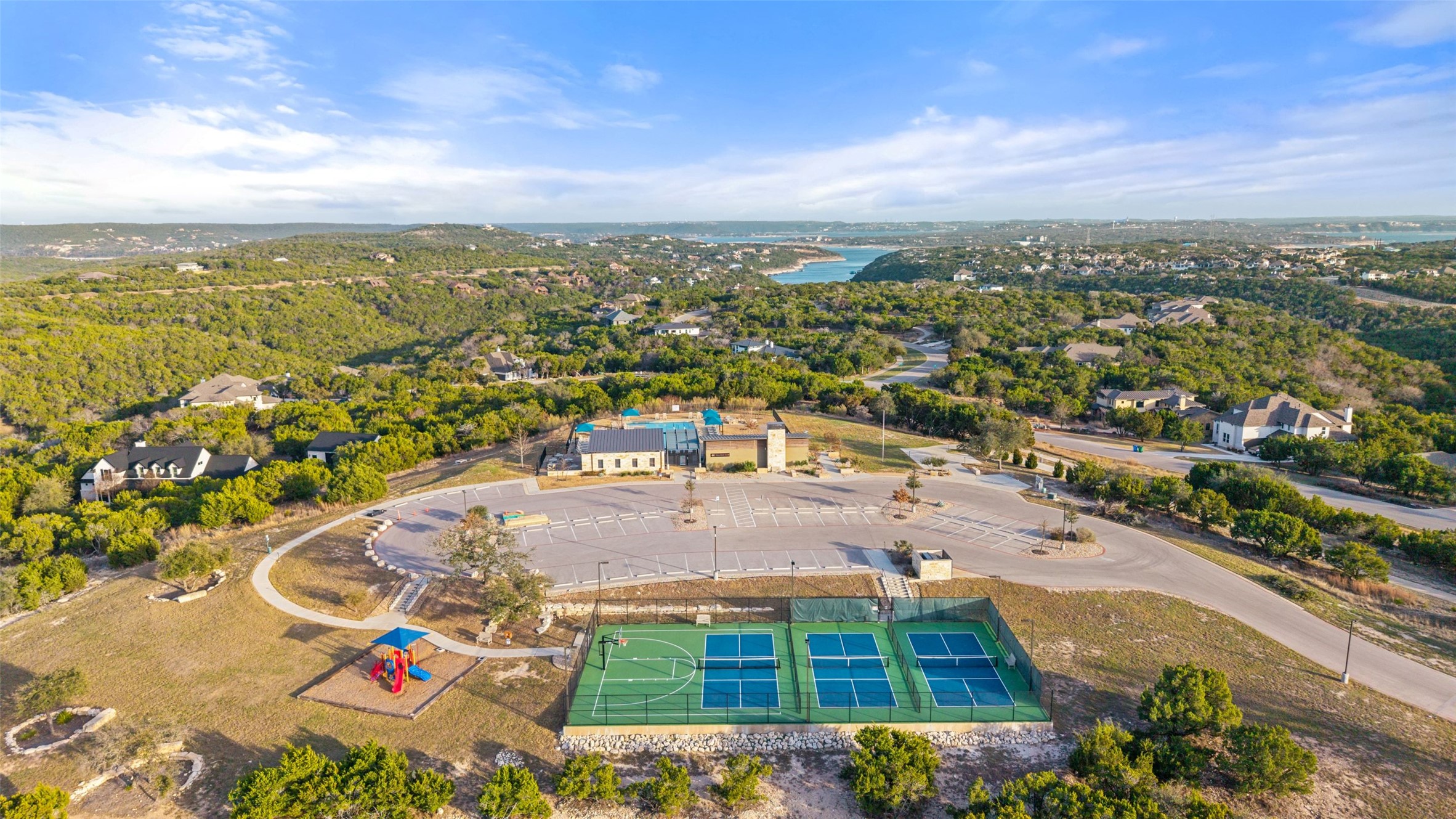 5420 Destination Way Jonestown, TX 78645 - Photo 27 of 40 Fantastic amenity center with multiple pools, hot tubs, and sports courts
