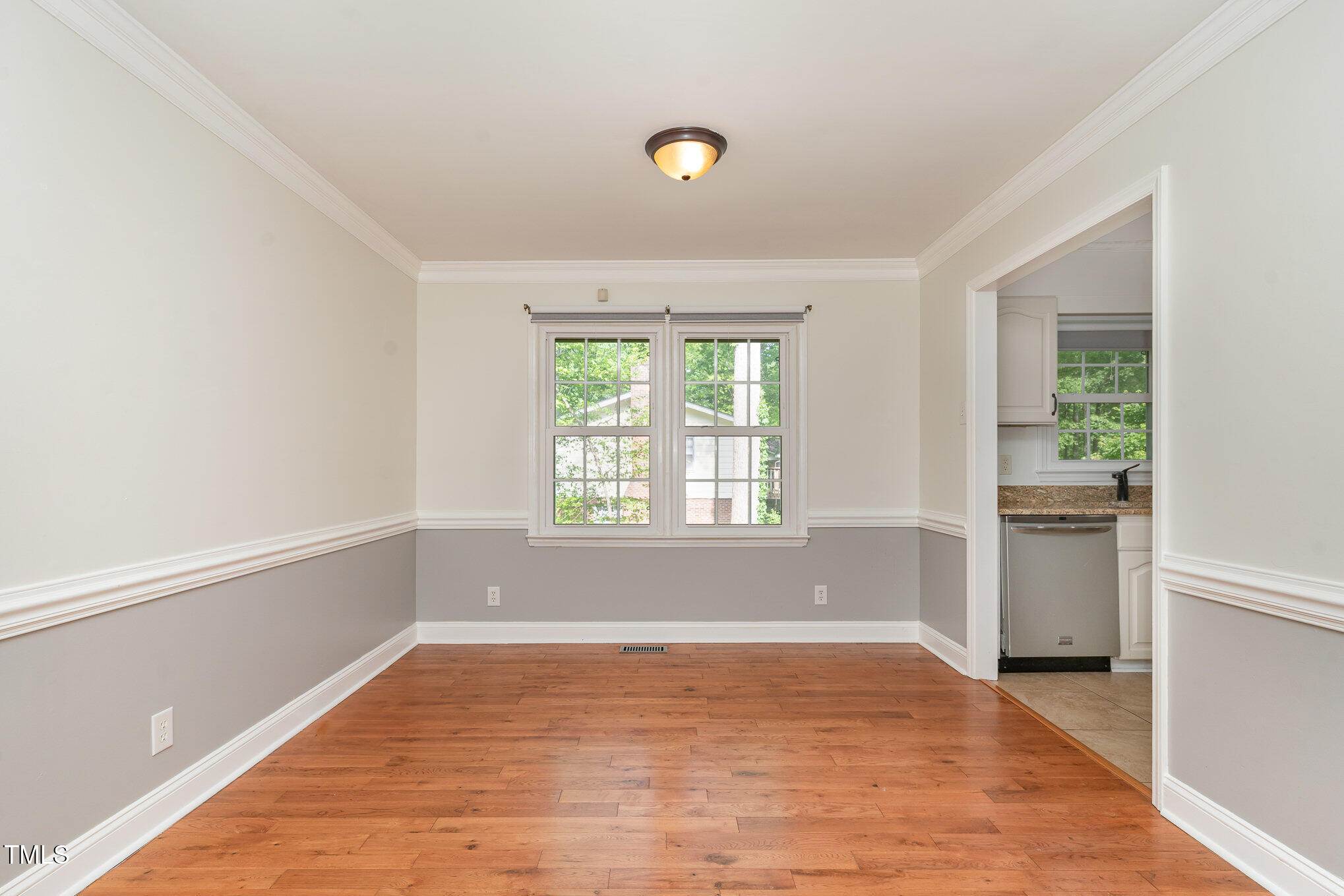 200 Weybossett Road Henderson, NC 27537 - Photo 12 of 30 a view of empty room with wooden floor and fan