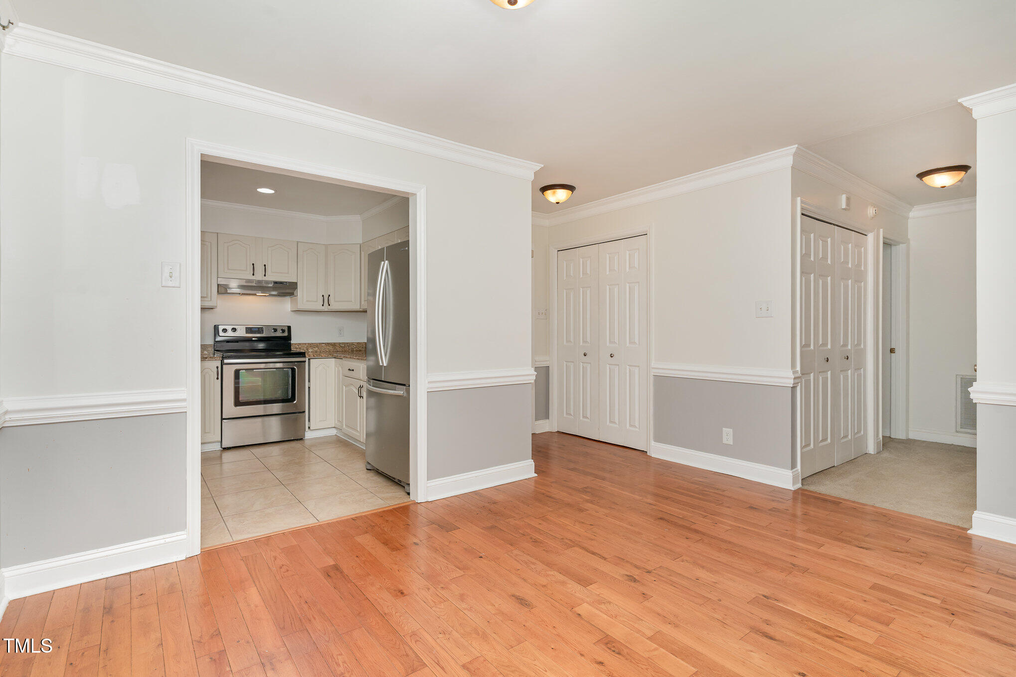 200 Weybossett Road Henderson, NC 27537 - Photo 13 of 30 a view of a kitchen with a refrigerator and a stove top oven