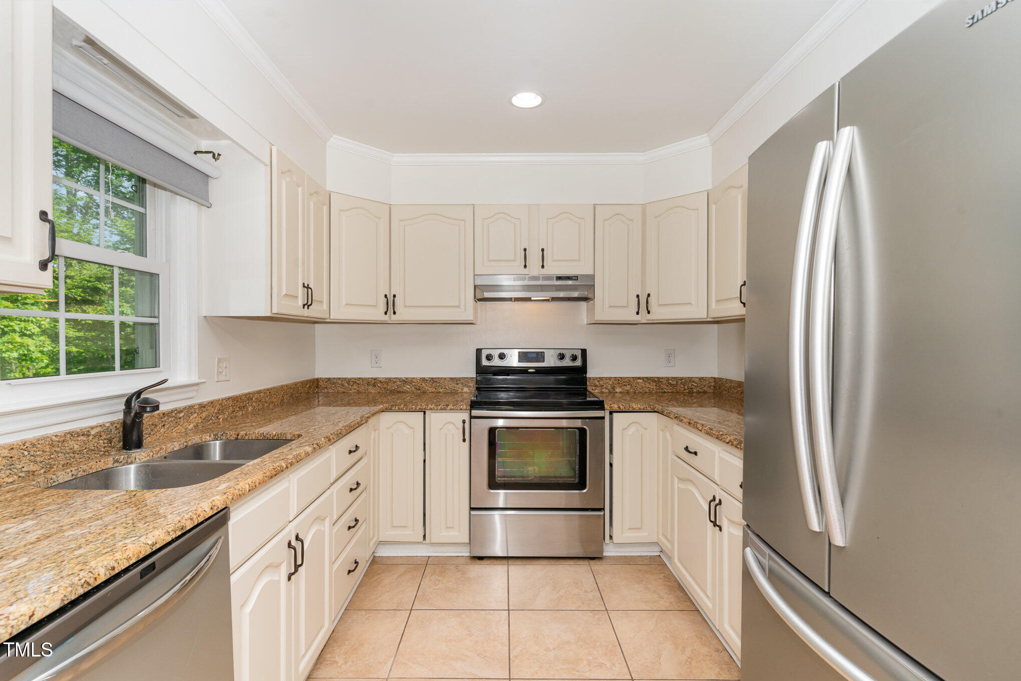 200 Weybossett Road Henderson, NC 27537 - Photo 14 of 30 a kitchen with stainless steel appliances granite countertop a sink stove and refrigerator