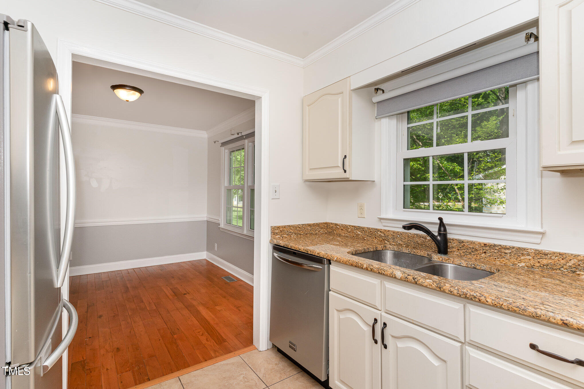 200 Weybossett Road Henderson, NC 27537 - Photo 15 of 30 a kitchen with granite countertop a sink and a window