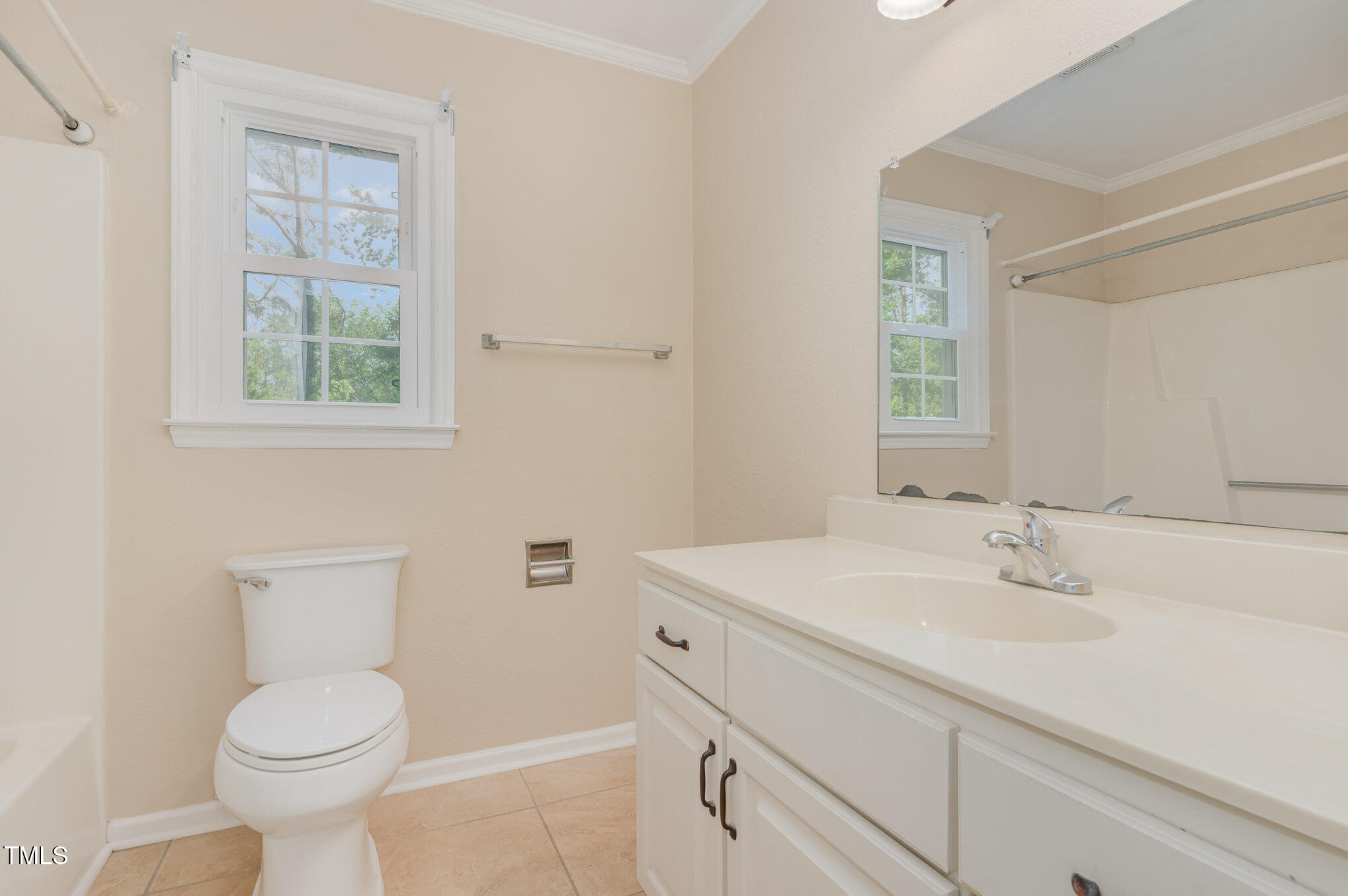 200 Weybossett Road Henderson, NC 27537 - Photo 16 of 30 a bathroom with a sink toilet and window