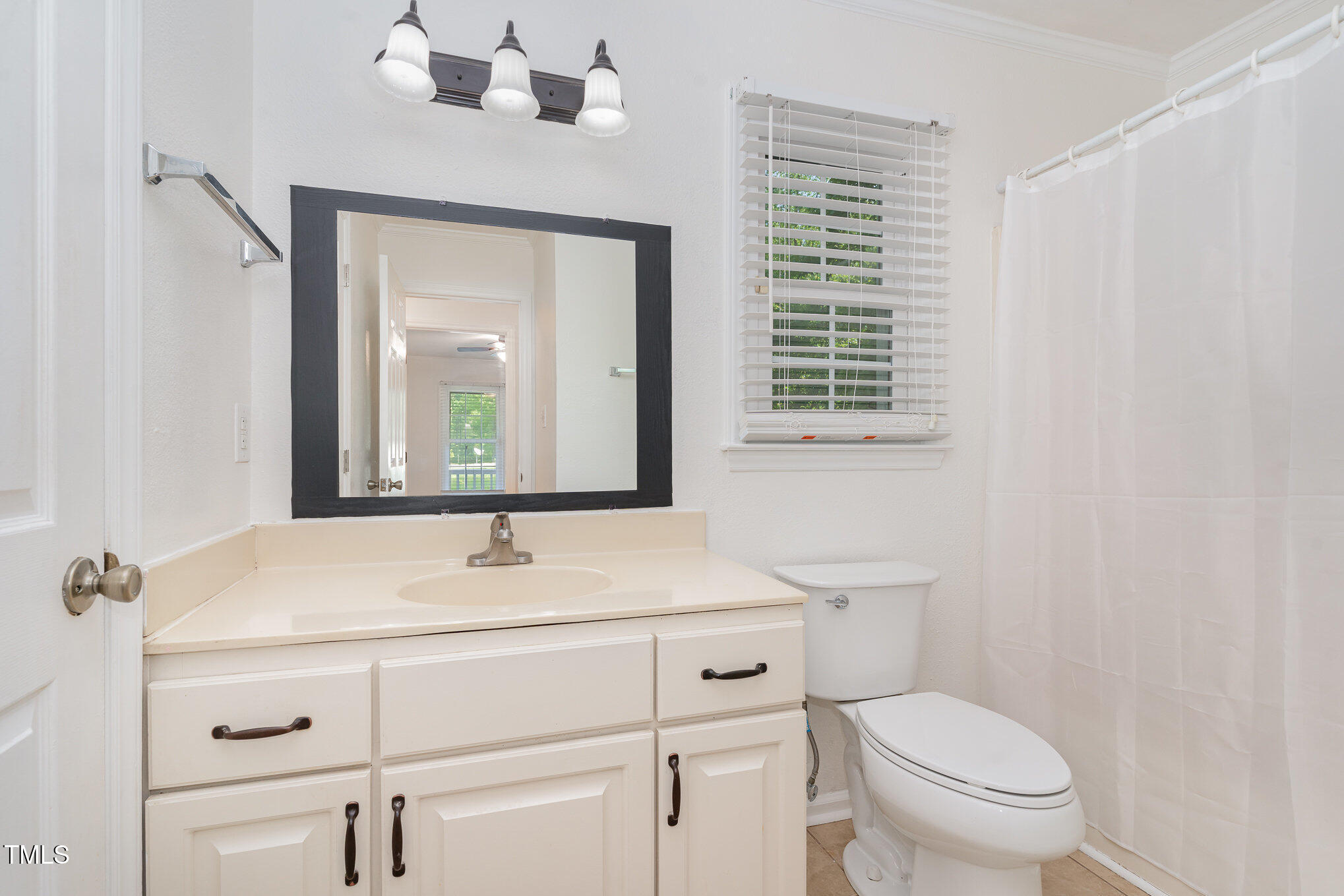 200 Weybossett Road Henderson, NC 27537 - Photo 19 of 30 a bathroom with a sink toilet vanity and mirror
