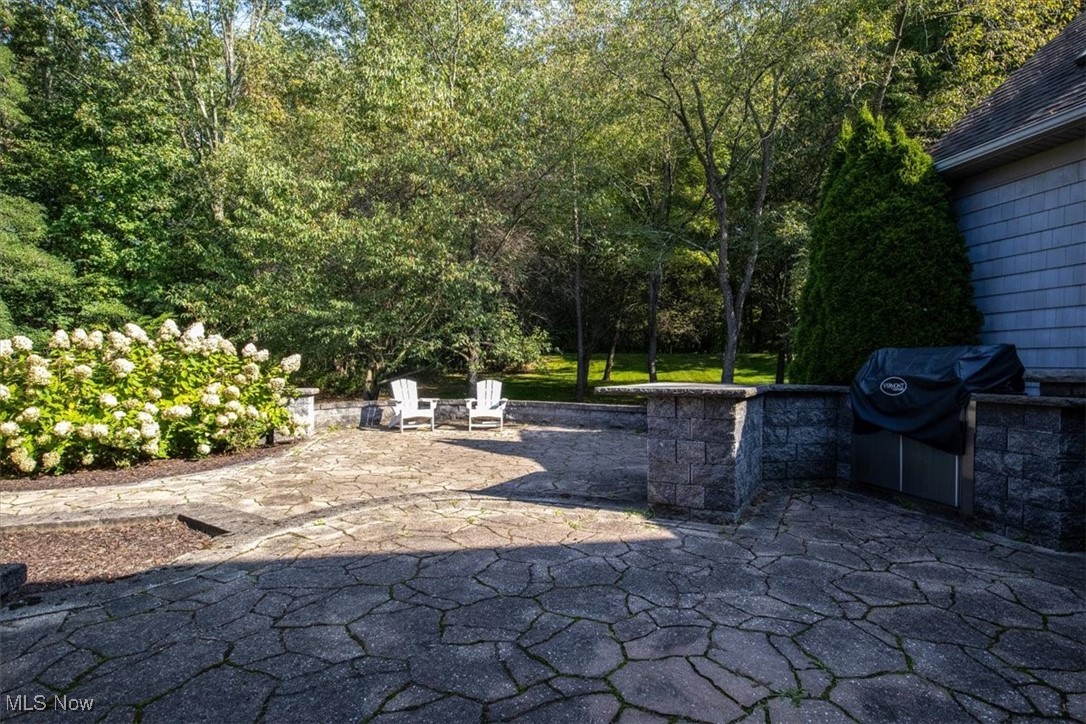 4679 Paxton Road Akron, OH 44321 - Photo 10 of 46 Wonderful stamped patio with built in grill, and nicely landscaped