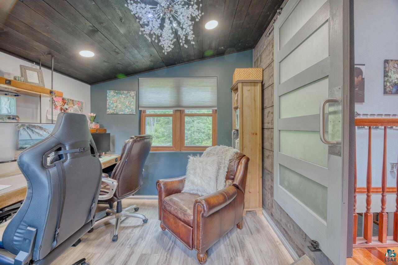 3935 Saari Road Hibbing, MN 55746 - Photo 17 of 48 Office area featuring vaulted ceiling and hardwood / wood-style floors