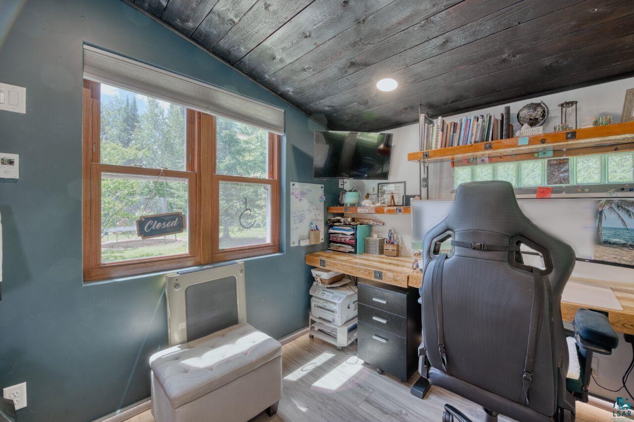 3935 Saari Road Hibbing, MN 55746 - Photo 19 of 48 Home office with light wood-type flooring, lofted ceiling, and wooden ceiling