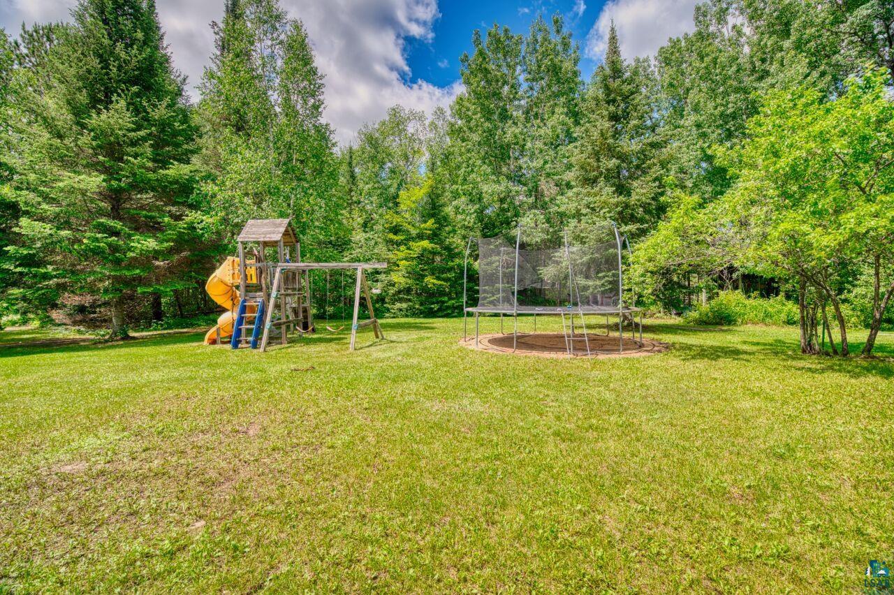 3935 Saari Road Hibbing, MN 55746 - Photo 38 of 48 View of yard with a playground and a trampoline