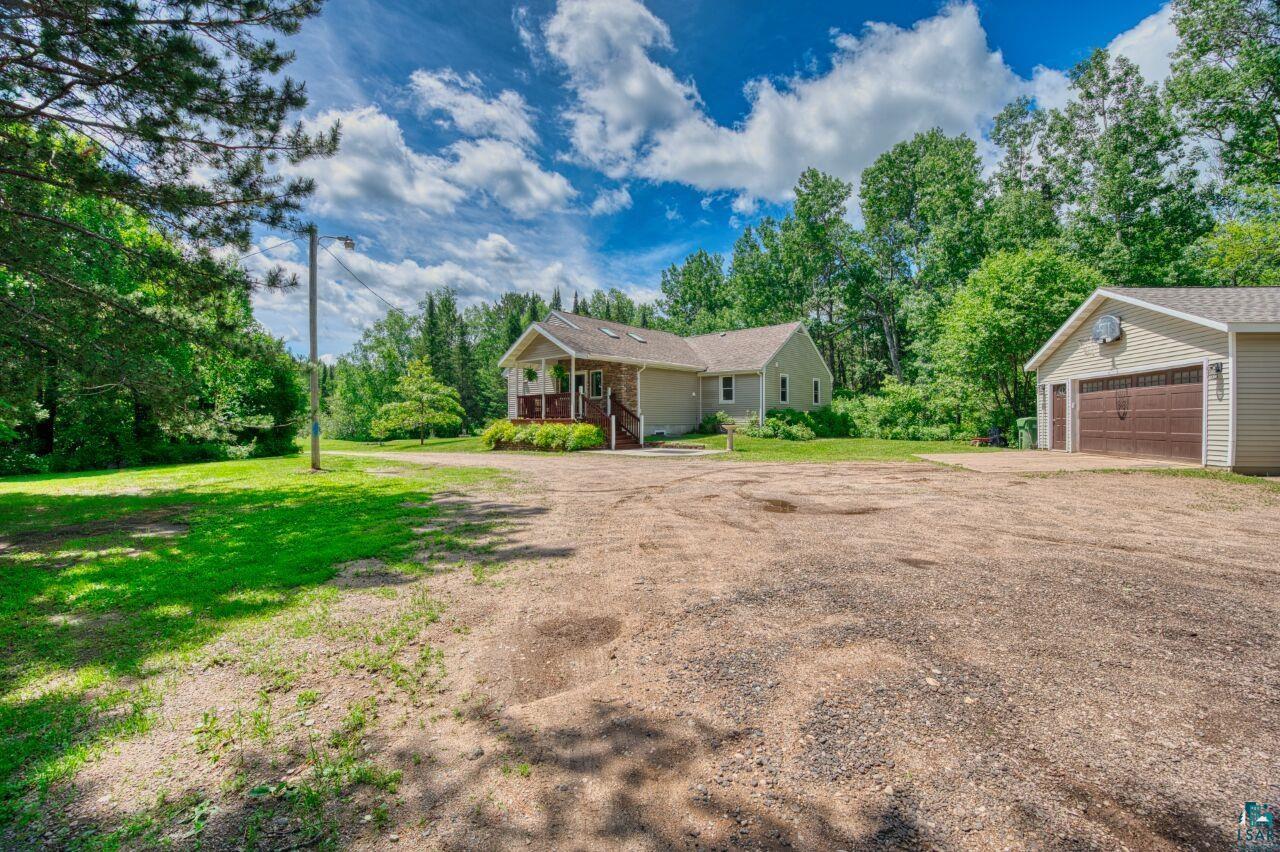3935 Saari Road Hibbing, MN 55746 - Photo 47 of 48 View of home's exterior with a garage and a yard