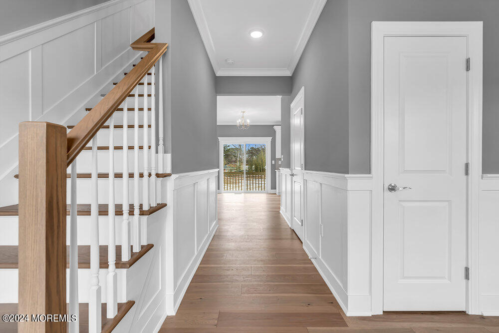 12 Sander Way Bayville, NJ 08721 - Photo 11 of 71 a view of a hallway with wooden floor and staircase