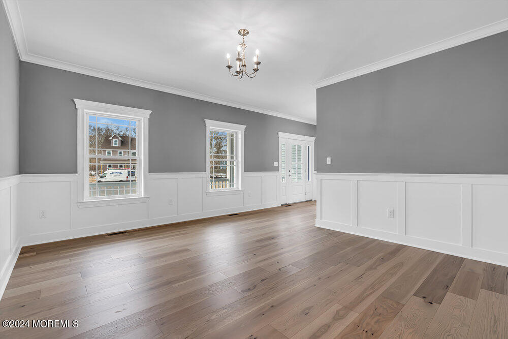 12 Sander Way Bayville, NJ 08721 - Photo 14 of 71 a view of an empty room with wooden floor and a window