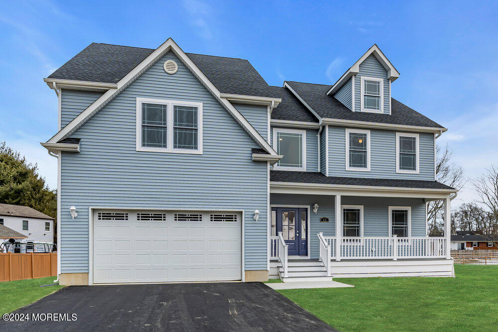 12 Sander Way Bayville, NJ 08721 - Photo 2 of 71 a front view of a house with a yard