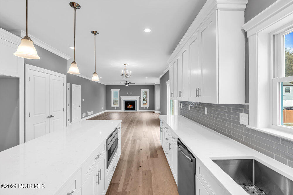 12 Sander Way Bayville, NJ 08721 - Photo 23 of 71 a large kitchen with kitchen island a large counter space a sink a window and stainless steel appliances