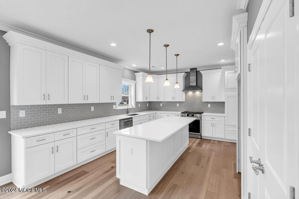 12 Sander Way Bayville, NJ 08721 - Photo 27 of 71 a kitchen with white cabinets and stainless steel appliances