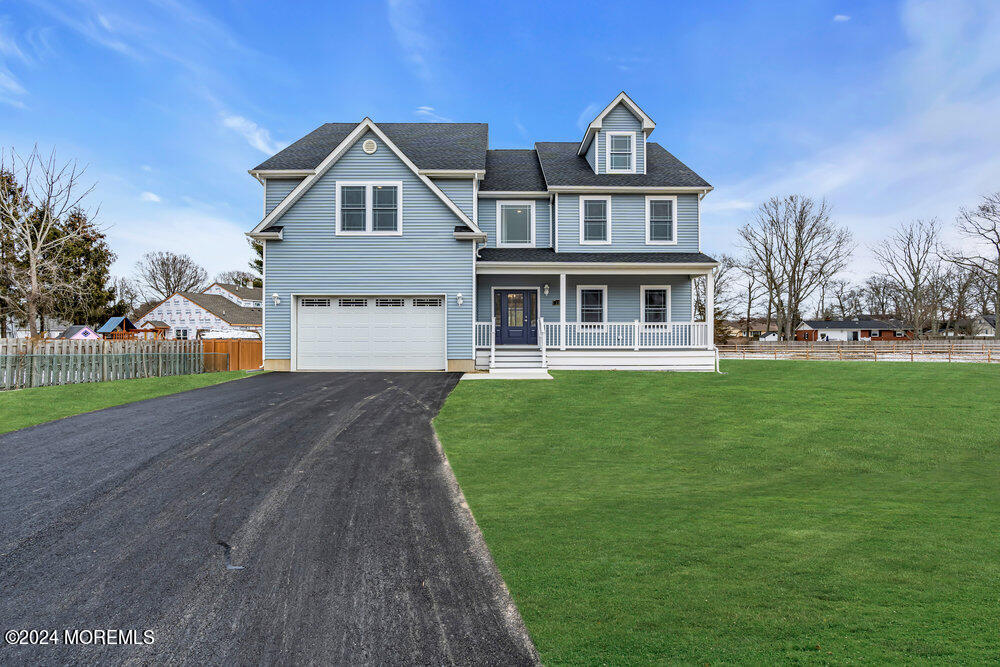 12 Sander Way Bayville, NJ 08721 - Photo 3 of 71 a front view of a house with a yard
