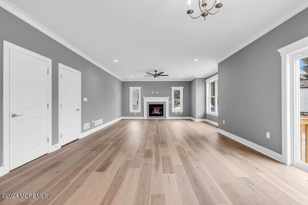 12 Sander Way Bayville, NJ 08721 - Photo 31 of 71 a view of an empty room with a fireplace and a window