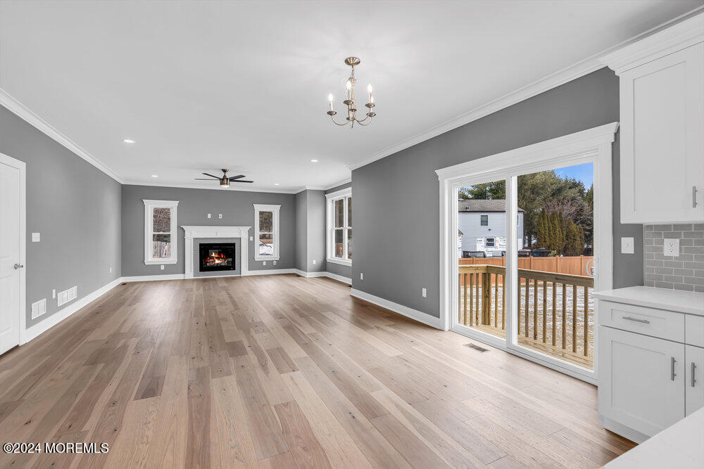 12 Sander Way Bayville, NJ 08721 - Photo 32 of 71 a view of an empty room with fire place and a window