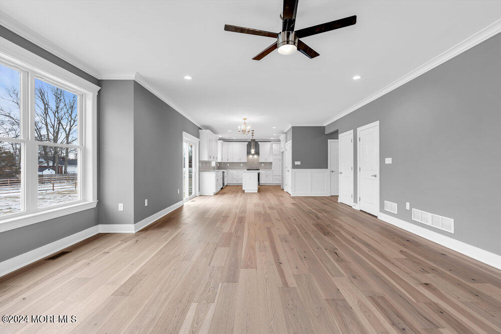 12 Sander Way Bayville, NJ 08721 - Photo 35 of 71 a view of empty room with wooden floor and window
