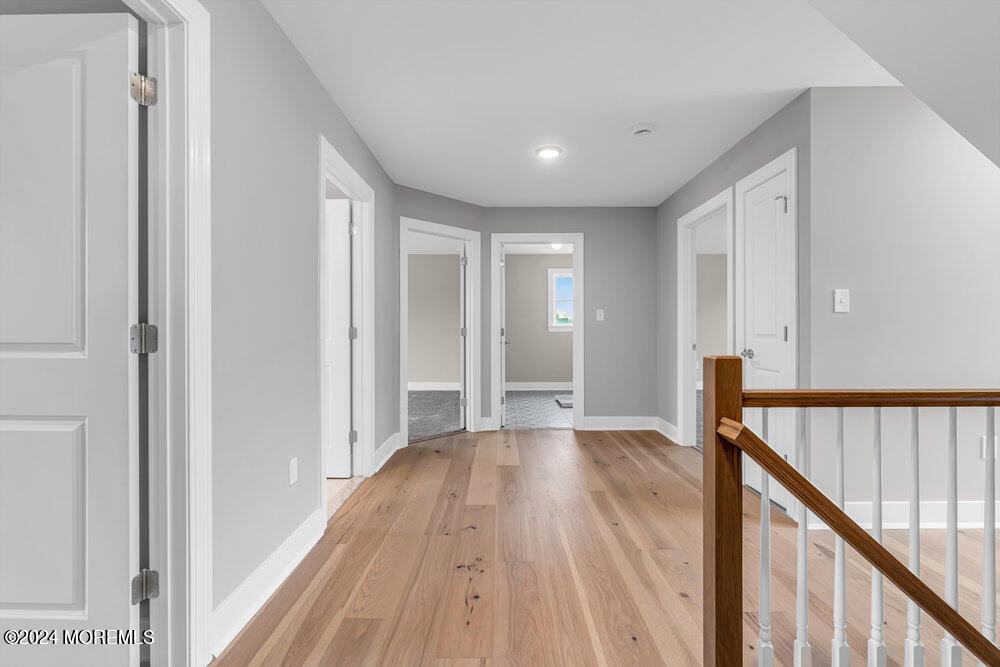 12 Sander Way Bayville, NJ 08721 - Photo 41 of 71 a view of a hallway with wooden floor