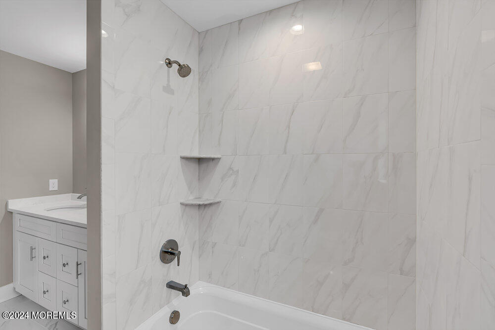 12 Sander Way Bayville, NJ 08721 - Photo 43 of 71 a bathroom with a bathtub and a shower