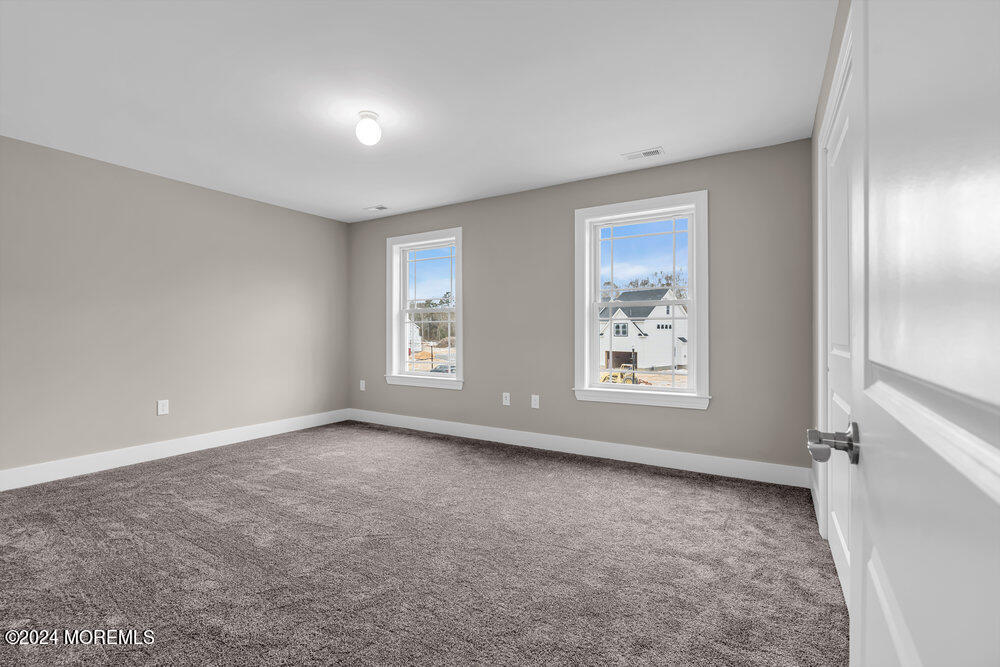 12 Sander Way Bayville, NJ 08721 - Photo 47 of 71 a view of an empty room with a window