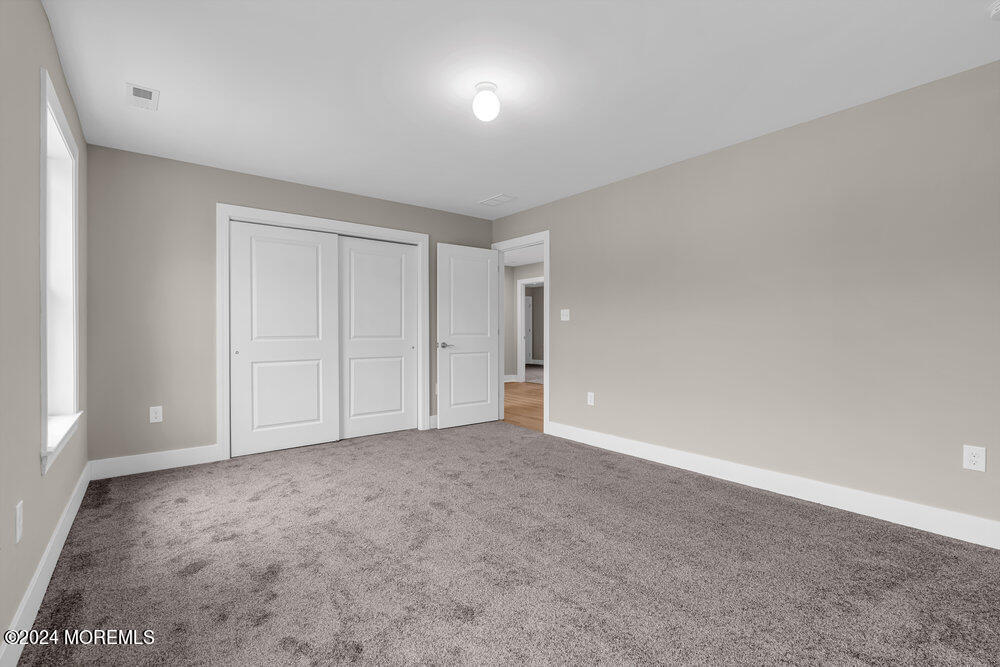 12 Sander Way Bayville, NJ 08721 - Photo 48 of 71 a view of an empty room