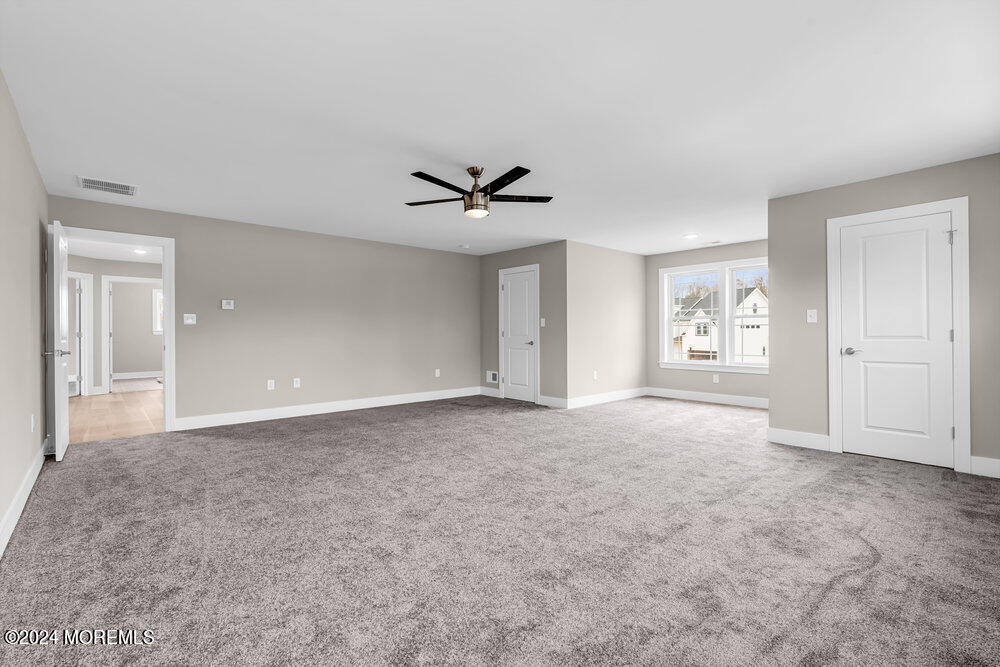 12 Sander Way Bayville, NJ 08721 - Photo 51 of 71 a view of a livingroom with a ceiling fan and window