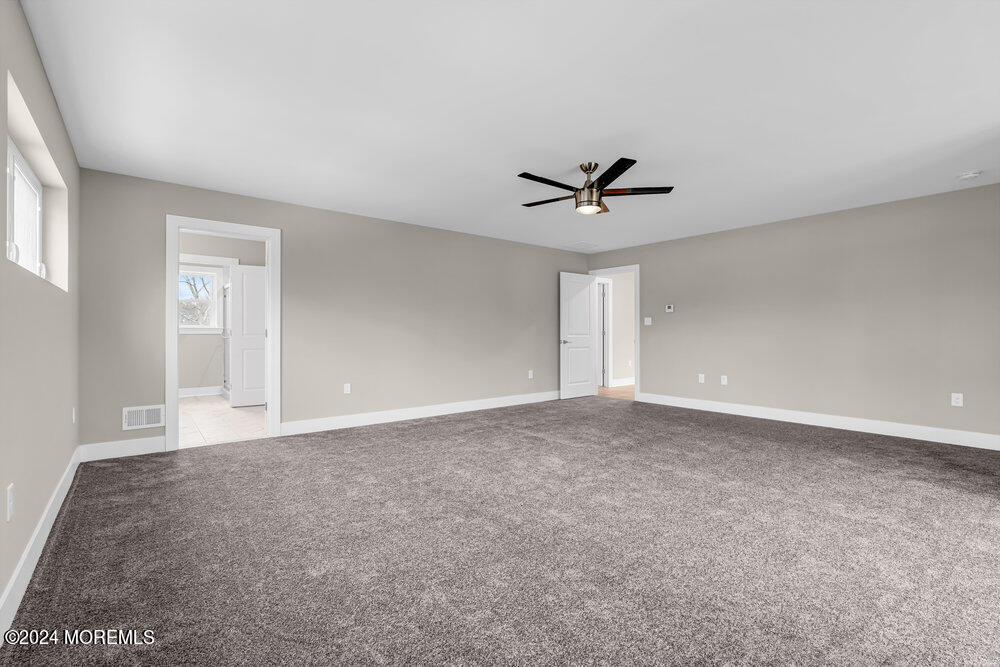12 Sander Way Bayville, NJ 08721 - Photo 53 of 71 a view of a livingroom with a ceiling fan and window