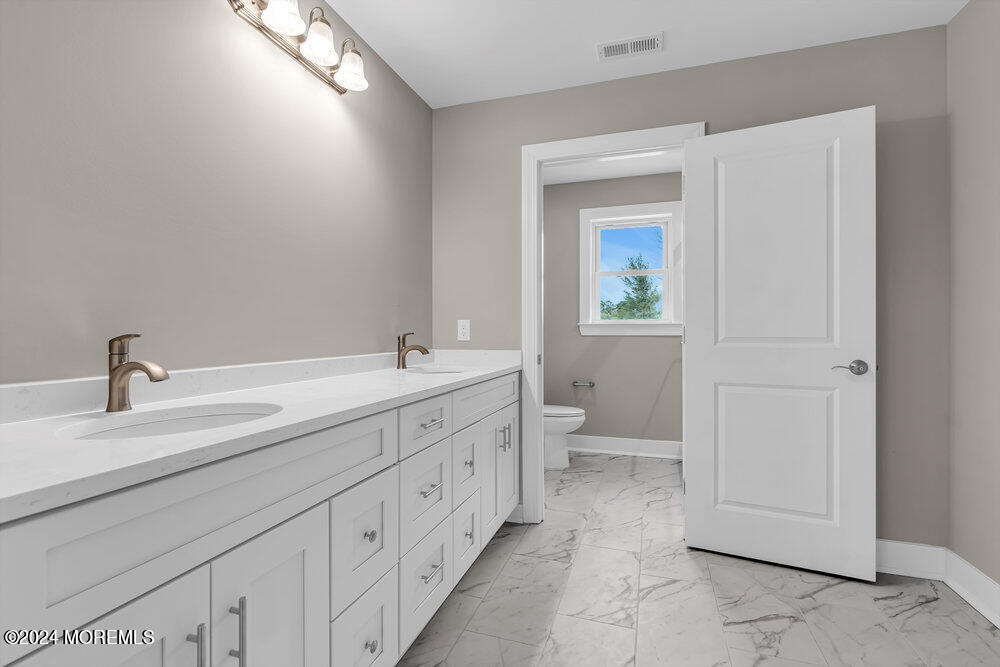 12 Sander Way Bayville, NJ 08721 - Photo 55 of 71 a spacious bathroom with 2 sink and a mirror